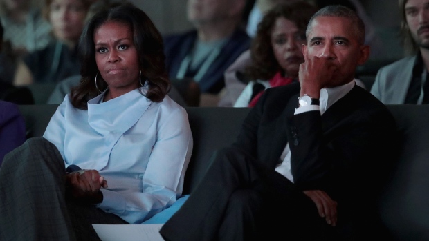 CHICAGO, IL - OCTOBER 31: Former first Lady Michelle and former president Barack Obama listen to speakers at the inaugural Obama Foundation Summit on October 31, 2017 in Chicago, Illinois. The two-day event will feature a mix of community leaders politicians and artists exploring creative solutions to common problems, and experiencing art, technology, and music from around the world. (Photo by Scott Olson/Getty Images)