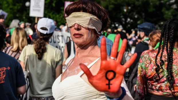 An abortion rights demonstrator wears a costume during a protest at Union Square in New York, US, on Friday, June 24, 2022. A deeply divided US Supreme Court overturned the 1973 Roe v. Wade decision and wiped out the constitutional right to abortion, issuing a historic ruling likely to render the procedure largely illegal in half the country.