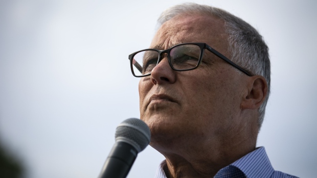 Jay Inslee, governor of Washington and 2020 presidential candidate, pauses while speaking at the Des Moines Register Soapbox during the Iowa State Fair in Des Moines, Iowa, U.S., on Saturday, Aug. 10, 2019. The 2020 Democratic field is gathering in Iowa for the showcase Iowa State Fair, a chance for candidates to meet with voters in the first primary contest of the presidential campaign -- and eat fattening food and view butter sculptures.