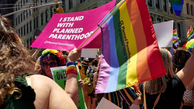 An attendee holds a sign supporting Planned Parenthood during the NYC Pride March in New York, U.S., on Sunday, June 26, 2022. New York City’s annual Pride March commemorates the 1969 uprising by members of the LGBTQ community at the Stonewall Inn in Greenwich Village. Photographer: Gabby Jones/Bloomberg