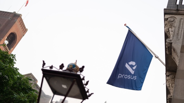 A Prosus flag is displayed ahead of the trading debut of the new Prosus NV unit of Naspers Ltd., outside the Amsterdam Stock Exchange, operated by Euronext NV, in Amsterdam, Netherlands, on Wednesday, Sept. 11, 2019. Naspers will retain 73% of the new company, which will house everything from a 31% stake in Chinese online giant Tencent to food delivery and advertising firms from the U.S. to India and Brazil. Photographer: Jasper Juinen/Bloomberg
