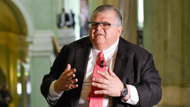 Agustin Carstens, chief executive officer of the Bank for International Settlements, gestures while speaking during a Bloomberg Television interview on the sidelines of a conference to celebrate the 350th anniversary of the Riksbank in Stockholm, Sweden, on Friday, May 25, 2018. The central bank has embarked on an historic monetary easing program over the past years to bring back inflation, using a weaker krona to help achieve its goal. Photographer: Mikael Sjoberg/Bloomberg