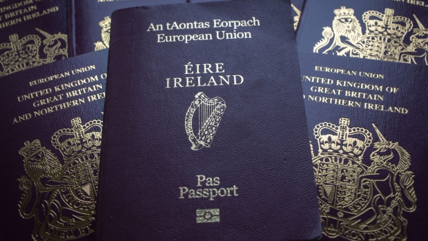 WELLS, ENGLAND - AUGUST 02: In this photo illustration a Irish passport is seen with United Kingdom passports on August 2, 2017 in Wells, England. Applications for Irish citizenship from people in the UK with Irish ancestry has doubled since the Brexit vote as people seek to secure an EU identity after Britain leaves the European Union. (Photo by Matt Cardy/Getty Images) Photographer: Matt Cardy/Getty Images Europe