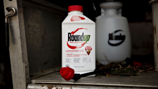 A bottle of Bayer AG Roundup brand weedkiller concentrate is arranged for a photograph in a garden shed in Princeton, Illinois, U.S., on Thursday, March 28, 2019. Bayer vowed to keep defending its weedkiller Roundup after losing a second trial over claims it causes cancer, indicating that the embattled company isn't yet ready to consider spending billions of dollars to settle thousands of similar lawsuits. Photographer: Daniel Acker/Bloomberg