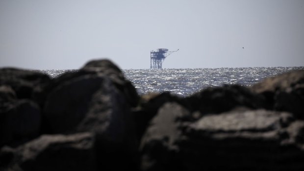 An offshore oil well platform in the Gulf of Mexico. Photographer: Luke Sharrett/Bloomberg