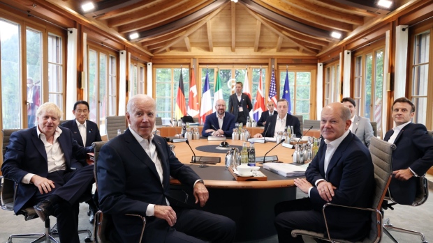 Boris Johnson, UK prime minister, Fumio Kishida, Japan's prime minister, US President Joe Biden, Charles Michel, president of the European Council, Mario Draghi, Italy's prime minister, Olaf Scholz, Germany's chancellor, Justin Trudeau, Canada's prime minister, and Emmanuel Macron, France's president, from left, prior to a meeting on the final day of the Group of Seven (G-7) leaders summit at the Schloss Elmau luxury hotel in Elmau, Germany, on Tuesday, June 28, 2022. The G-7 leaders agreed that they want ministers to urgently discuss and evaluate how the prices of Russian oil and gas can be curbed to limit revenues flowing to President Vladimir Putin’s government in Moscow.