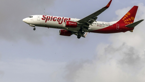 A SpiceJet Ltd. aircraft prepares to take off at Chhatrapati Shivaji International Airport in Mumbai, India, on Monday, July 10, 2017. India, which was the world’s fastest growing aviation market last year, is crucial for planemakers like Boeing Co. and Airbus SE, as airlines see increased demand from the rising middle class. Photographer: Dhiraj Singh/Bloomberg