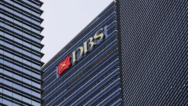 The DBS Group Holdings Ltd. logo is displayed atop Tower 3 of the Marina Bay Financial Centre in Singapore, on Wednesday, Feb. 12, 2020. The coronavirus outbreak rocked Singapore's financial district after an infection at the country’s biggest bank prompted it to evacuate 300 workers. Photographer: Ore Huiying/Bloomberg