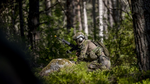 A soldier performs during the Baltic Operations NATO military drills (Baltops 22) on June 11, 2022 in the Stockholm archipelago, the 30,000 islands, islets and rocks off Sweden's eastern coastline. Fourteen NATO allies and two NATO partner nations, Finland and Sweden, are participating in the exercise with more than 45 ships, 75 aircraft and 7,500 personnel. 