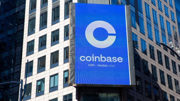 A monitor displays Coinbase signage during the company's initial public offering (IPO) at the Nasdaq MarketSite in New York, U.S., on Wednesday, April 14, 2021. Coinbase Global Inc., the largest U.S. cryptocurrency exchange, is set to debut on Wednesday through a direct listing, an alternative to a traditional initial public offering that has only been deployed a handful of times. Photographer: Michael Nagle/Bloomberg