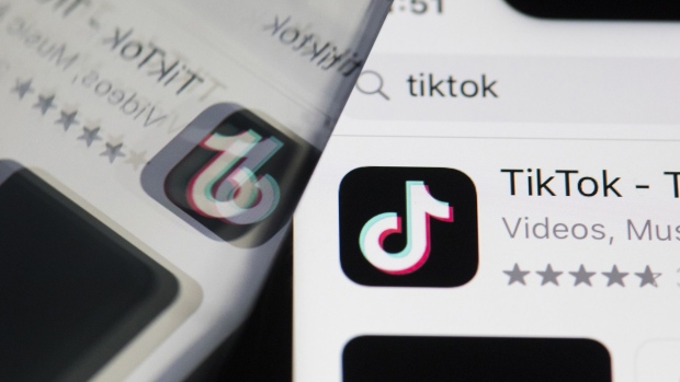 The download page for ByteDance Ltd.'s TikTok app is arranged for a photograph on a smartphone in Sydney, New South Wales, Australia, on Monday, Sept. 14, 2020. Oracle Corp. is the winning bidder for a deal with TikTok’s U.S. operations, people familiar with the talks said, after main rival Microsoft Corp. announced its offer for the video app was rejected. Photographer: Brent Lewin/Bloomberg