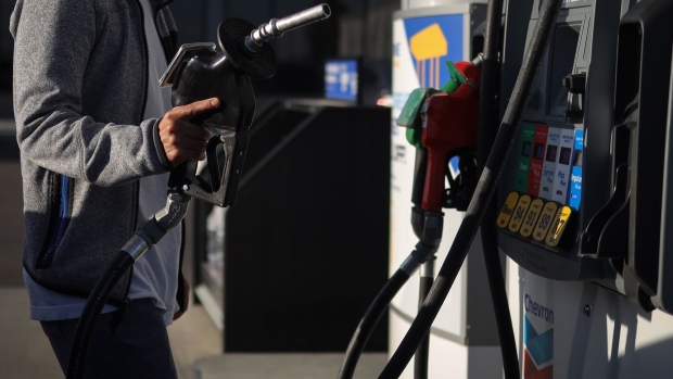 A customer refuels at a Chevron Corp. gas station in Calgary, Alberta, Canada, on Friday, Aug. 14, 2020. Despite a 24% drop in fuel and petroleum product volumes, Parkland Corp., which runs gas stations under the Chevron, Esso, Pioneer and other brands in Canada, posted 12.1% growth in same-store sales at its convenience stores last quarter. Photographer: Leah Hennel/Bloomberg