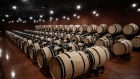 Wine barrels sit in the cellars of Chateau La Dominique vineyard and winery in Pomerol, France, on Monday, Sept. 23, 2019. The U.S. is moving ahead with an investigation into a new French digital tax that could lead to import tariffs on French wine and other goods, despite hopes raised at August's G-7 summit.