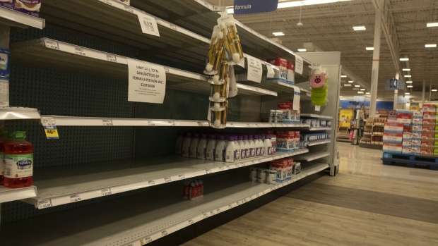 A sign in front of empty shelves notifies customers that they are allowed only one container of baby formula at a store in Provo, Utah, US, on Tuesday, May 17, 2022. President Joe Biden said he expects increased imports of baby formula to relieve a US shortage “in a matter of weeks or less,” as pressure mounts from parents and lawmakers to address the problem. Photographer: George Frey/Bloomberg