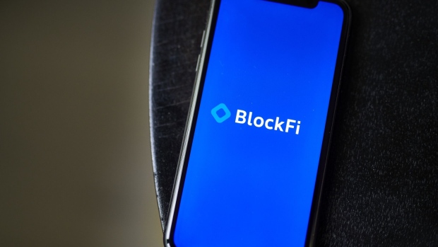 The BlockFi logo on a smartphone arranged in Little Falls, New Jersey, U.S., on Saturday, May 22, 2021. Elon Musk continued to toy with the price of Bitcoin Monday, taking to Twitter to indicate support for what he says is an effort by miners to make their operations greener. Photographer: Gabby Jones/Bloomberg