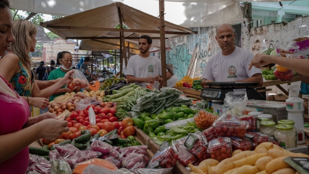 Shoppers browse produce at an outdoor market in the Tijuca neighborhood of Rio de Janeiro, Brazil, on Tuesday, April 5, 2022. Although Brazil's central bank is months into an aggressive tightening campaign, the country's inflation rate was still 11.3% in March.