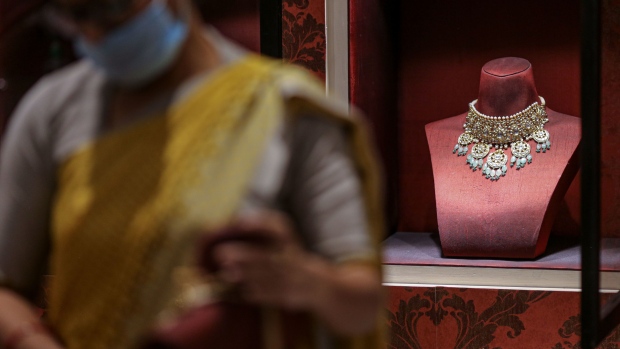 A gold necklace displayed inside a Titan Co. Tanishq jewelry store during the festival of Dhanteras in Mumbai, India, on Tuesday, Nov. 2, 2021. Indians flocked to jewelry stores on the biggest gold-buying day of the year, with a bumper sales period for precious metals that culminates in the festival of Diwali expected for the first time since the pandemic began.