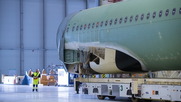 The assembled fuselage of an Airbus A320 narrow-body passenger twin-engine jet airliner moves across the Airbus SE factory floor in Hamburg, Germany, on Tuesday, Feb. 27, 2018. Airbus's plan to further lift production of its A320neo jet faces resistance from both engine suppliers after Safran SA joined Pratt & Whitney in suggesting the move would strain resources to the limit.