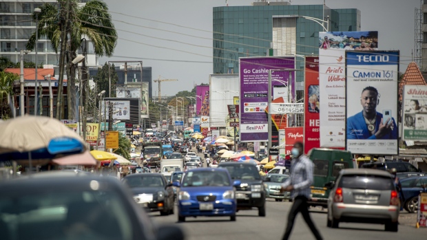 Vehicles travel along a road in Accra, Ghana, on Tuesday, Oct. 23, 2020. Ghana is missing out on a rally of African bonds as investors fret about an expansion in spending and borrowing ahead of elections in December. Photographer: Cristina Aldehuela/Bloomberg