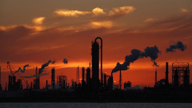 Emissions rise from an oil refinery at sunset in Texas City, Texas, U.S., on Thursday, Feb. 16, 2017. Asia's energy importers will benefit from more opportunities for arbitrage, supply diversification if U.S. President Donald Trump's pro-energy policies drive meaningful upsurge in U.S. crude, LNG exports, BMI Research reports.