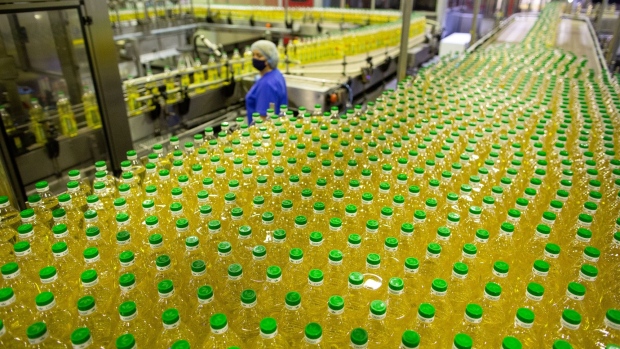 Bottles of sunflower oil move along the production line at the EFKO JSC plant in Alekseyevka, Russia, on Friday, April 30, 2021. Russia published details in March of a formula-based export duty for sunflower oil, which will be implemented from Sept. 1.