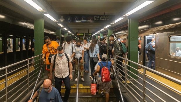 Commuters exit a subway station in New York, US, on Thursday, June 30, 2022. The head of New York's Metropolitan Transportation Authority warned the agency's anticipated $2 billion budget gap may widen in 2026 as it struggles to win back riders.