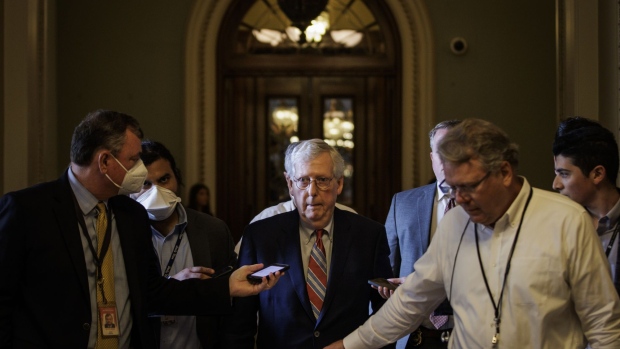 Senate Minority Leader Mitch McConnell, a Republican from Kentucky, walks back to his office from the floor of the US Senate in Washington, D.C., US, on Tuesday, June 21, 2022. The White House and congressional Democrats are in advanced talks on legislation that aims to fight inflation, rein in the deficit and revive parts of President Joe Biden's stalled economic agenda.