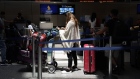 A traveler waits for a Singapore Airlines flight inside Tom Bradley International Terminal at Los Angeles International Airport (LAX) in Los Angeles, California, US, on Friday, July 1, 2022. As travel is ramping up for the July 4th holiday, staffing shortages are causing problems for some of the nation's largest airlines.