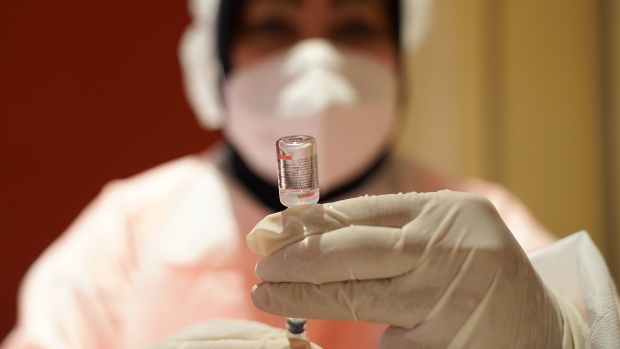 A healthcare worker prepares a dose of the Sinovac Biotech Ltd. Covid-19 vaccine during a vaccination drive at Jakarta International Expo in the Kemayoran area in Jakarta, Indonesia, on Wednesday, Jan. 26, 2022. Indonesia needs around 100 million extra vaccine doses for its booster program, most of which were being met by donations from the Covax facility and the rest via bilateral agreements. Photographer: Dimas Ardian/Bloomberg