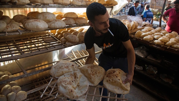 A worker arranges freshly baked bread for sale at the Al-Monira market in Cairo, Egypt, on Wednesday, June 1, 2022. Global food prices are soaring near the fastest pace ever as Russia’s invasion of Ukraine chokes crop supplies, with Egypt, the world’s biggest wheat buyer, now grappling with higher import bills as the conflict causes a run-up in grain and energy costs.