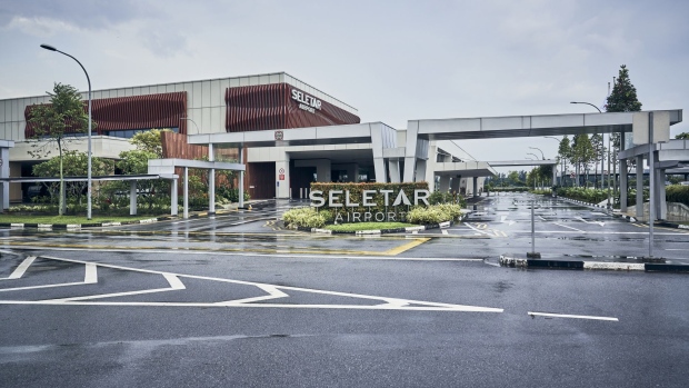 Patrons dine at a cafe inside the departure hall at Seletar Airport.