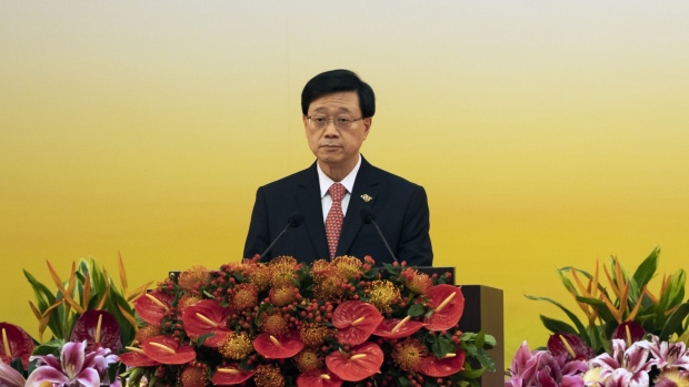 John Lee, Hong Kong's chief executive, speaks at a swearing-in ceremony in Hong Kong, China, on Friday, July 1, 2022. Hong Kong’s new security-minded leader was sworn in by President Xi Jinping as the city marks 25 years of Chinese rule, after declaring the Asian financial hub had been “reborn” after a crackdown on the pro-democracy opposition. Photographer: Justin Chin/Bloomberg