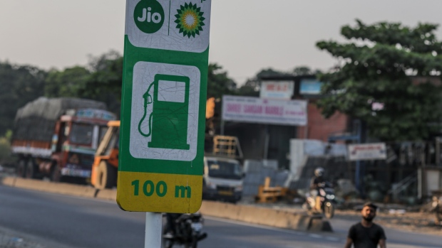 A sign outside the newly-opened Jio-BP gas station in Mumbai, India, on Tuesday, Oct. 26, 2021. Reliance Industries Ltd. and BP Plc.’s fuel and mobility joint venture Reliance BP Mobility Ltd. Tuesday launched its first Jio-BP branded mobility station at Navde near Mumbai, the oil-to-retail conglomerate said in a statement. Photographer: Dhiraj Singh/Bloomberg