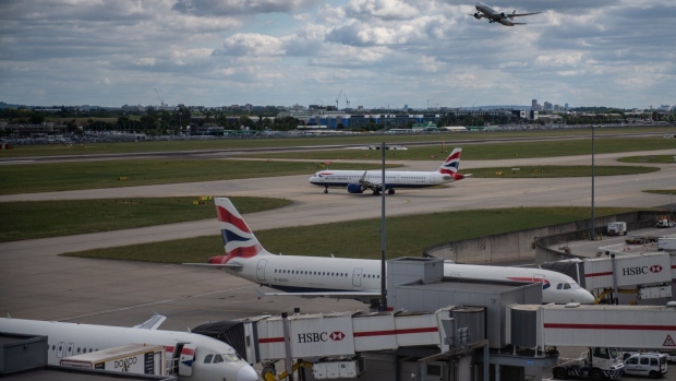 Passenger aircraft, operated by British Airways, a unit of International Consolidated Airlines Group SA (IAG), on the tarmac at London Heathrow Airport in London, UK, on Monday, June 13, 2022. Heathrow airport said its policy of carefully matching flight availability to resources as travel rebounds has been vindicated, citing a lack of disruption even as customer numbers reached their highest level since the start of the pandemic.