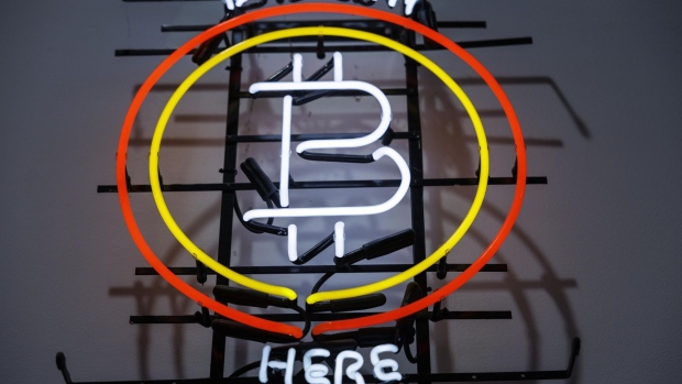 A neon sign indicates that Bitcoin is available inside an Alza.cz store in Prague, Czech Republic, on Tuesday, May 17, 2022. Crypto companies have started to plan for a potential protracted market slowdown.