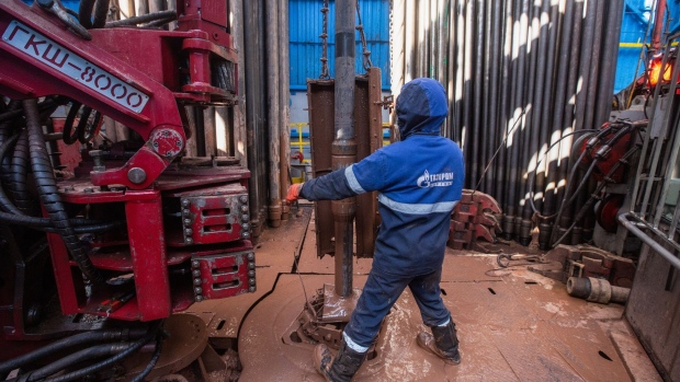 A worker fits drilling pipes at the Gazprom PJSC gas drilling rig in the Kovyktinskoye gas field, part of the Power of Siberia gas pipeline project, near Irkutsk, Russia, on Wednesday, April 7, 2021. Built by Russian energy giant Gazprom PJSC, the pipeline runs about 3,000 kilometers (1,864 miles) from the Chayandinskoye and Kovyktinskoye gas fields in the coldest part of Siberia to Blagoveshchensk, near the Chinese border.
