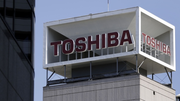 Signage for Toshiba Corp. displayed at the company's headquarters in Tokyo, Japan, on Wednesday, April 7, 2021. Toshiba surged its daily limit of 18% after confirming it received an initial buyout offer from CVC Capital Partners, setting the stage for potentially the largest private equity-led acquisition in years. Photographer: Kiyoshi Ota/Bloomberg