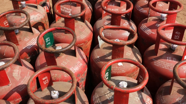 Indian Oil Corp. Indane brand liquefied petroleum gas (LPG) cylinders at a village warehouse in Greater Noida, Uttar Pradesh, India, on Monday, Feb. 22, 2021. Provisions for LPG cooking fuel subsidies, launched in 2016 by the Modi government offering cash rebates for purchasing an LPG connection and a loan for the first canister of the fuel and stove, were halved in the federal budget for the fiscal year ending March 2022 to 124.8 billion rupees ($1.7 billion) from 255 billion rupees a year earlier. Photographer: T. Narayan/Bloomberg