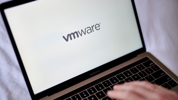 The VMware logo on a laptop computer arranged in the Brooklyn borough of New York, US, on Monday, May 23, 2022. Broadcom Inc. is in talks to acquire VMware Inc., the cloud-computing company backed by billionaire Michael Dell, setting up a blockbuster tech deal that would vault the chipmaker into a highly specialized area of software. Photographer: Gabby Jones/Bloomberg