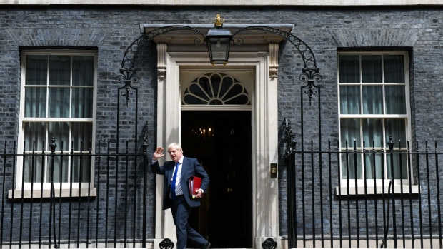 Boris Johnson, UK prime minister, departs 10 Downing Street to attend a weekly questions and answers session in Parliament in London, UK, on Wednesday, July 6, 2022. Boris Johnson is digging in as UK prime minister, after the resignation of two of the most senior members of his government brought his premiership to the brink on another febrile day in Westminster.