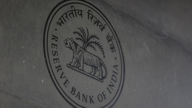 The Reserve Bank of India (RBI) logo displayed at its headquarters in Mumbai, India, on Saturday, Feb. 5, 2022. The RBI is set to outline its policy on Feb. 9 and is expected to take further steps like raising the reverse repo rate to further pull back on pandemic-era steps. Photographer: Dhiraj Singh/Bloomberg