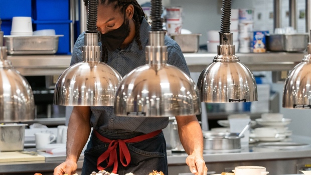 An employee works inside the kitchen at the New York Marriott Marquis in New York.
