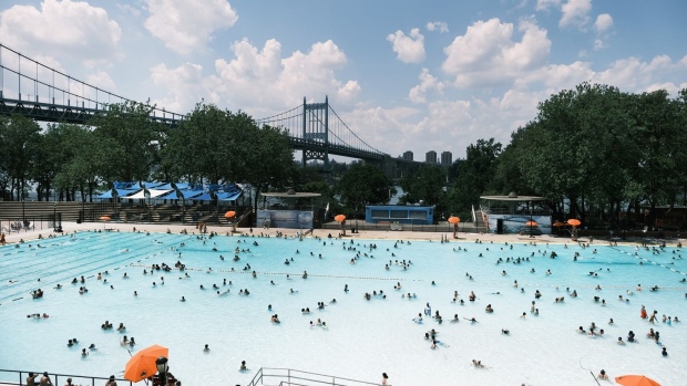 People cool off in a public swimming pool on June 29, 2021 in the Astoria neighborhood of the Queens borough in New York City.