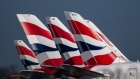 The British Airways livery on the tail fins of passenger aircraft at London Heathrow Airport in London, U.K., on Wednesday, Feb. 23, 2022. International Consolidated Airlines Group SA, the parent company of British Airways, are due to report results on Friday. Photographer: Chris J. Ratcliffe/Bloomberg
