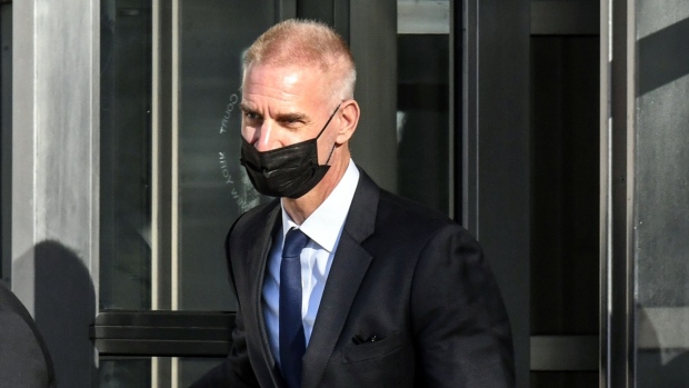 Tim Leissner, former chairman of Southeast Asia for Goldman Sachs Group Inc., center, departs from federal court in the Brooklyn borough of New York, U.S., on Tuesday, Feb. 15, 2022. Ng is accused of conspiring to violate U.S. anti-money-laundering law in a scheme to loot billions from the Malaysian fund known as 1MDB.