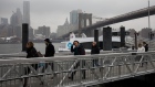 Commuters disembark a NYC Ferry at Brooklyn Bridge Park in the Brooklyn borough of New York, U.S., on Friday, March 1, 2019. A rally in shares of technology companies helped push the broader U.S. equity market up from the lows of the day. Treasuries fell for a third day and oil slumped.