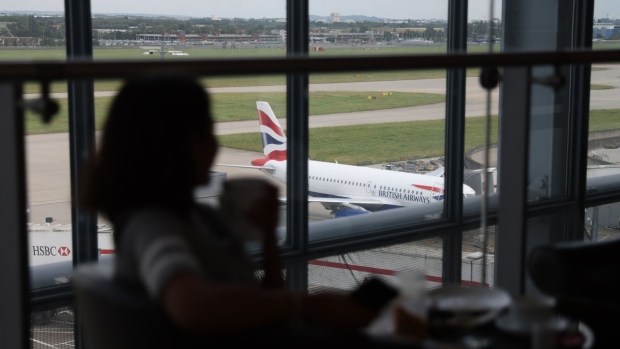 A British Airways passenger aircraft, operated by International Consolidated Airlines Group SA, on the tarmac at London Heathrow Airport Ltd. in London, U.K., on Tuesday, July 27, 2021. International Consolidated Airlines Group SA are due to report earnings on July 30.