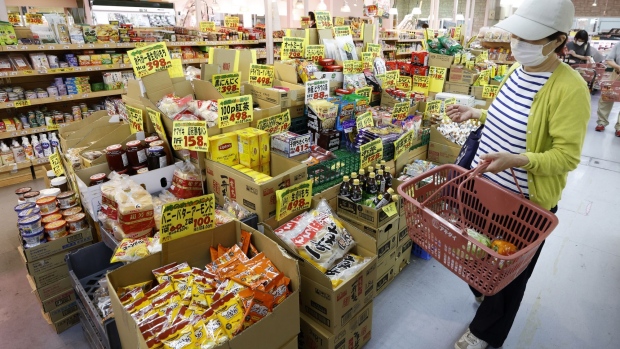 A customer shops at an Akidai YK supermarket in Tokyo, Japan, on Monday, June 27, 2022. Japan's key inflation gauge stayed above the Bank of Japan's target level of 2%, a result that will likely keep speculation alive over possible policy adjustments at the central bank.
