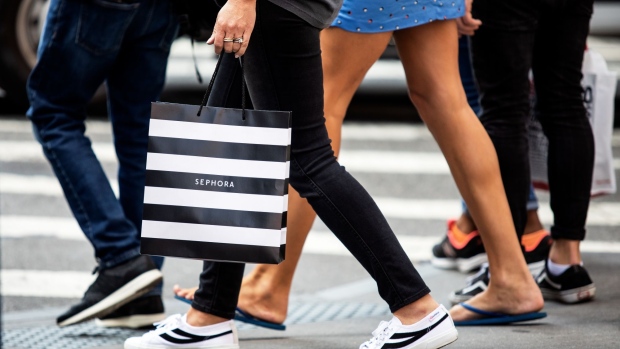 A pedestrian carries a Sephora USA Inc. shopping bag while walking along a street in New York, U.S., on Wednesday, Sept. 25, 2019. Bloomberg is scheduled to release consumer comfort figures on October 3. Photographer: Demetrius Freeman/Bloomberg