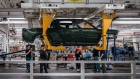 Workers assembly components of a Rivian R1T electric vehicle (EV) pickup truck at the company's manufacturing facility in Normal, Illinois, US., on Monday, April 11, 2022. Rivian Automotive Inc.�produced 2,553 vehicles in the first quarter as the maker of plug-in trucks contended with a snarled supply chain and pandemic challenges.